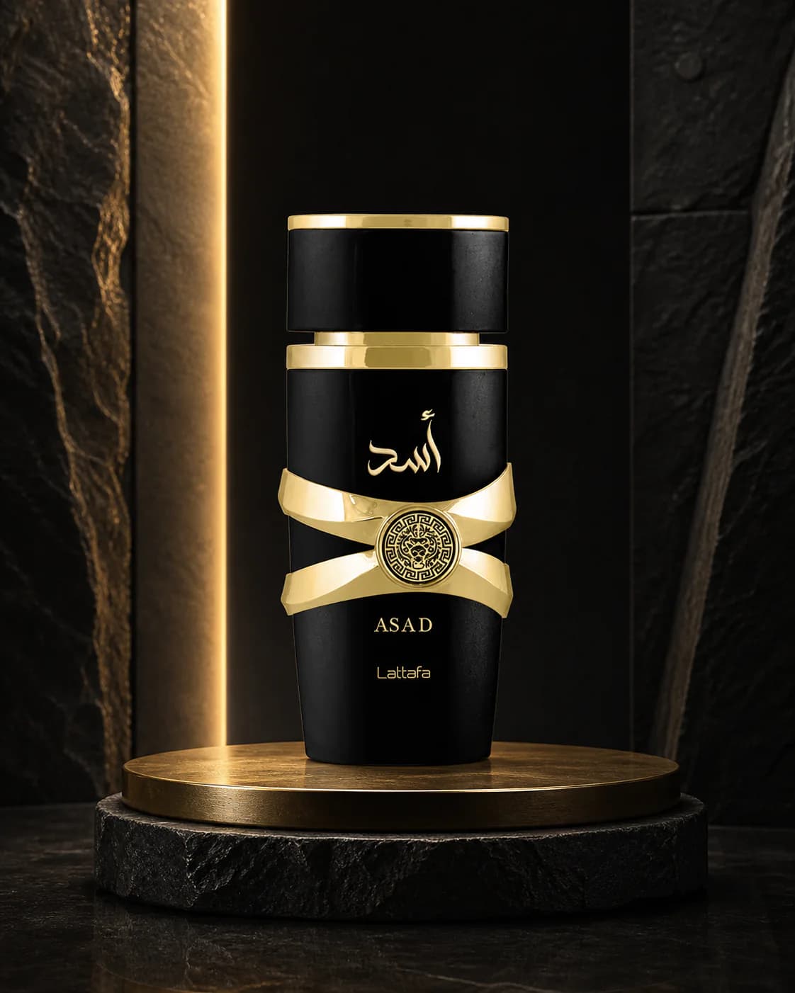 Lattafa Asad bottle in black and gold on a stone podium under warm light