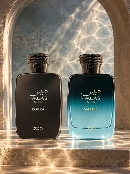 Rasasi Hawas Kobra and Hawas Malibu perfume bottles in a sunlit stone alcove