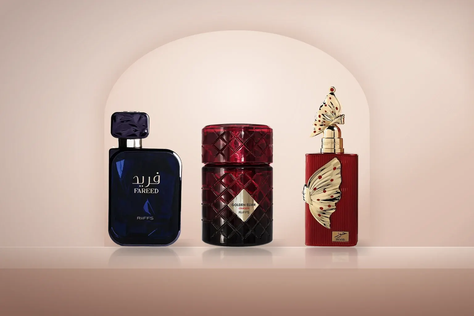 Riiffs Fareed, Golden Elixir Crimson and Hoor bottles on a blush stone ledge