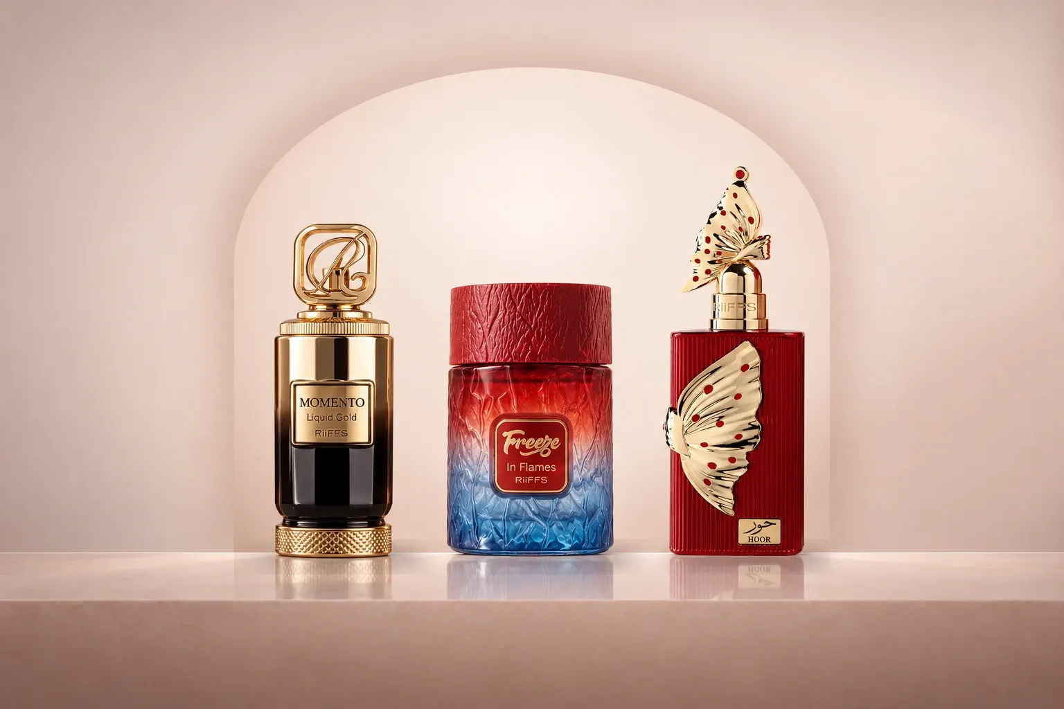 RiiFFS Momento Liquid Gold, Freeze In Flames and Hoor perfume bottles in a soft blush arched alcove