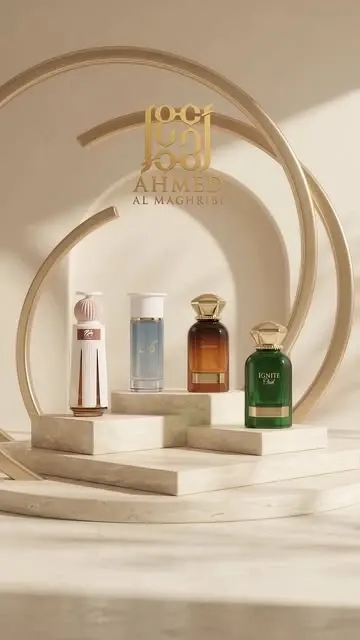 Four Ahmed Al Maghribi perfume bottles on cream stone beneath gold arches